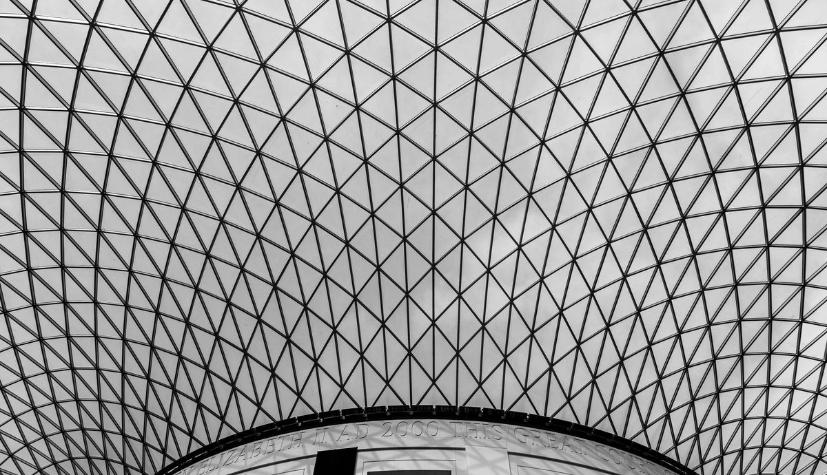 Latticed glass and steel roof structure